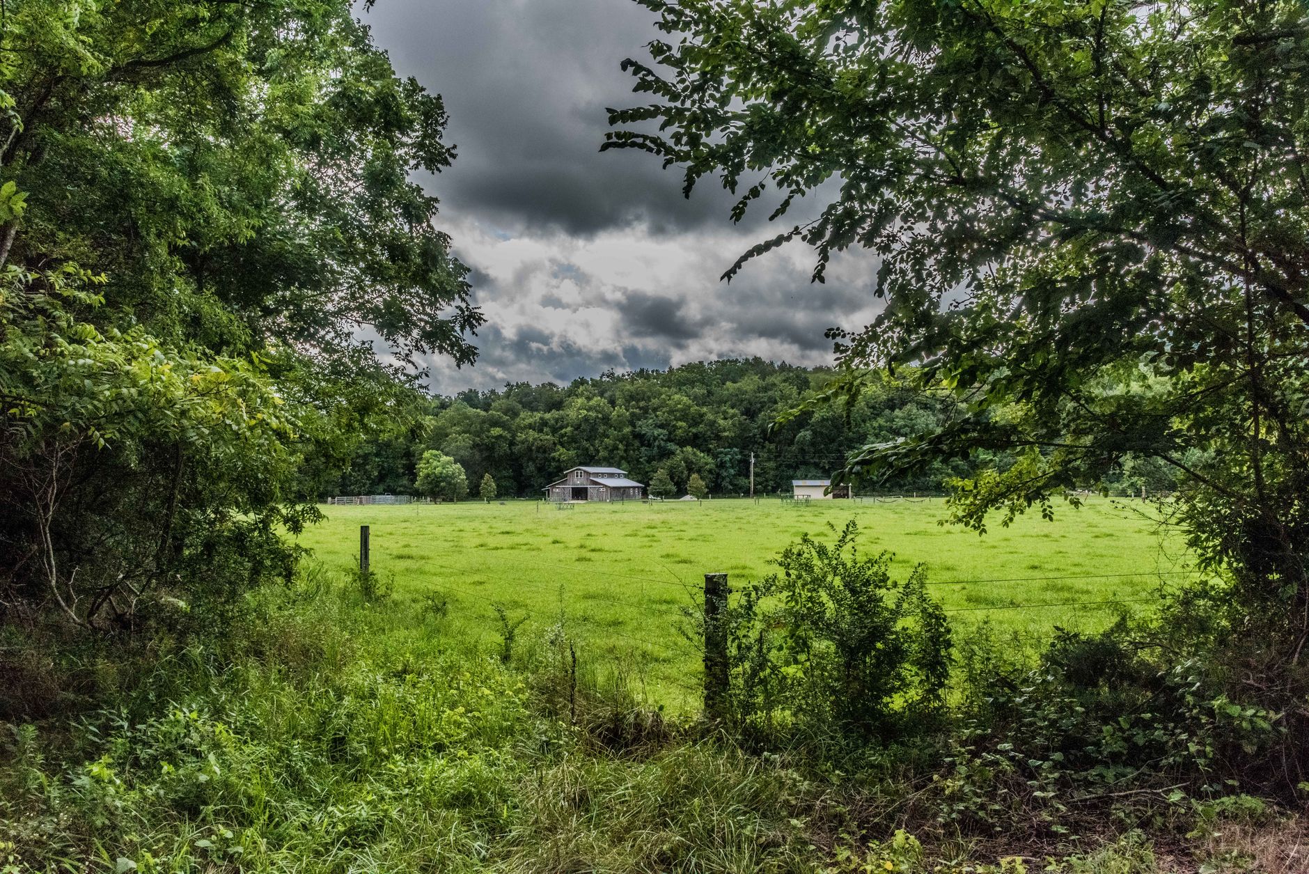 Rural Tennessee farmland and forested hillside, White County landscape.