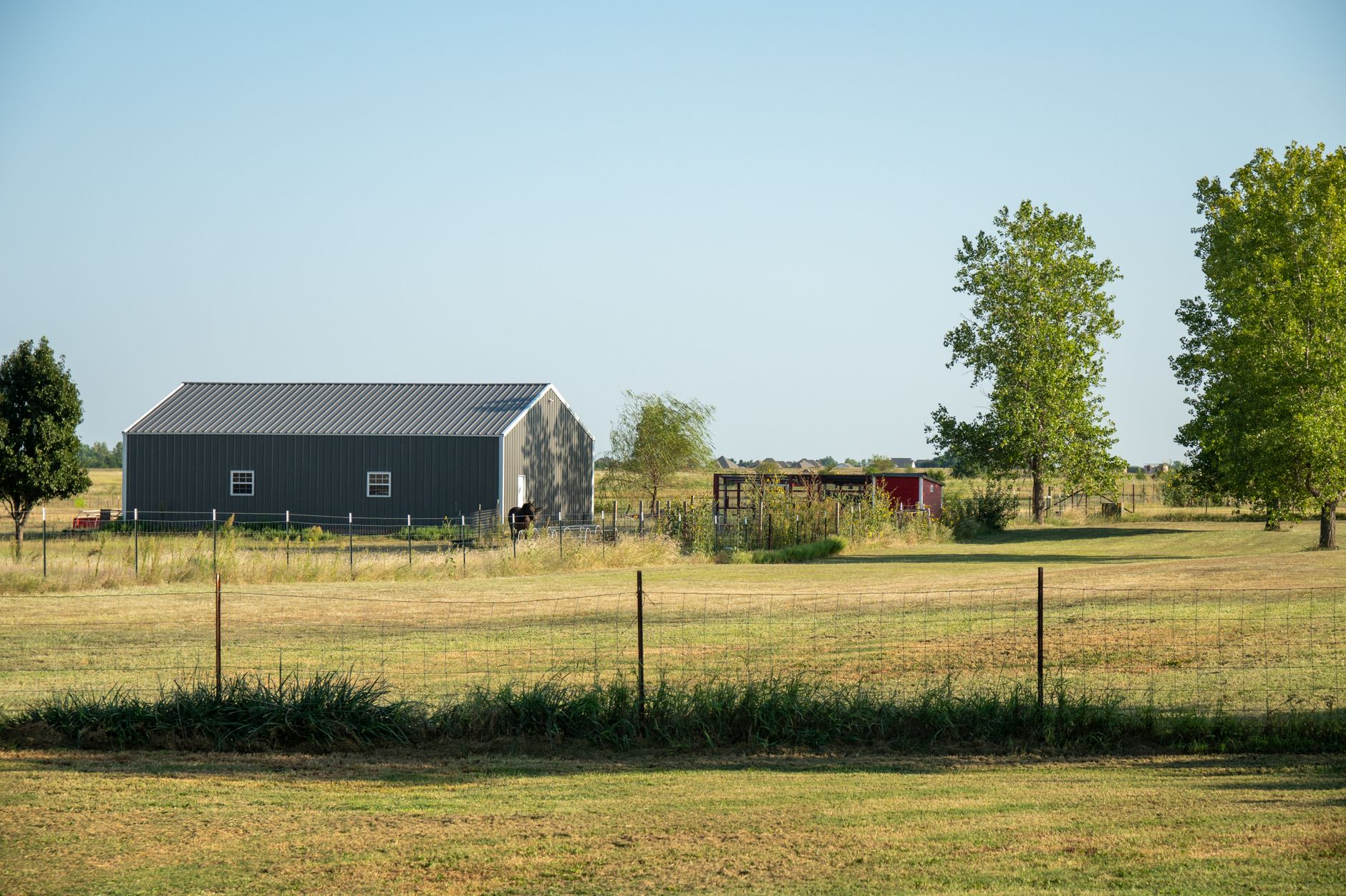 Rural Oklahoma prairie and ranchland near Ponca City at sunset