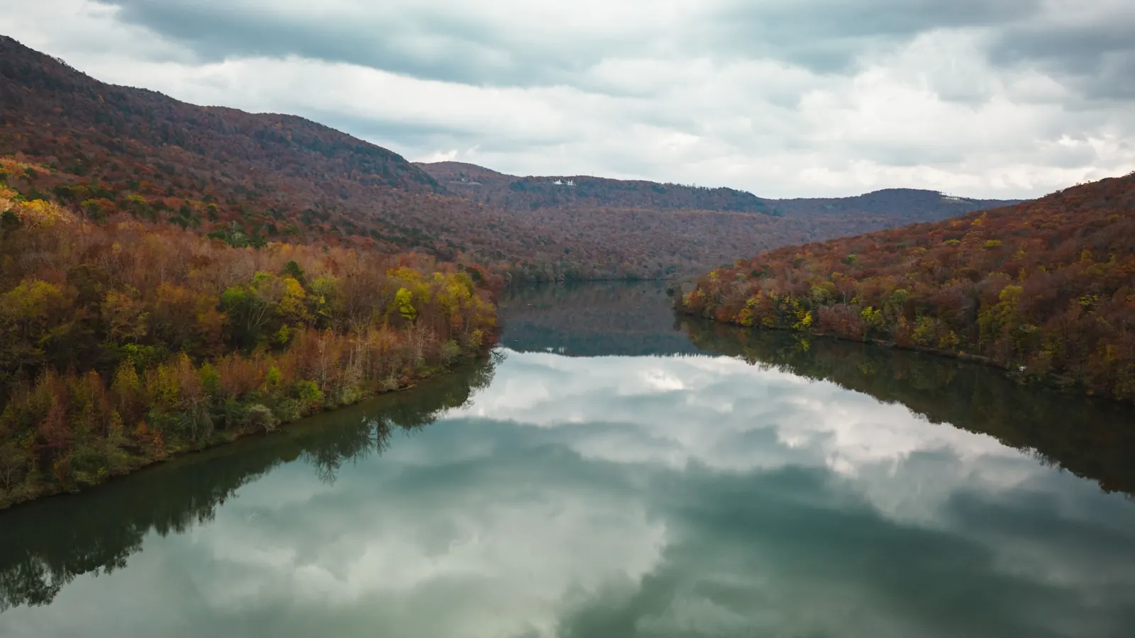 Autumn reflection over a Tennessee mountain lake — recreational land in the Cumberland region